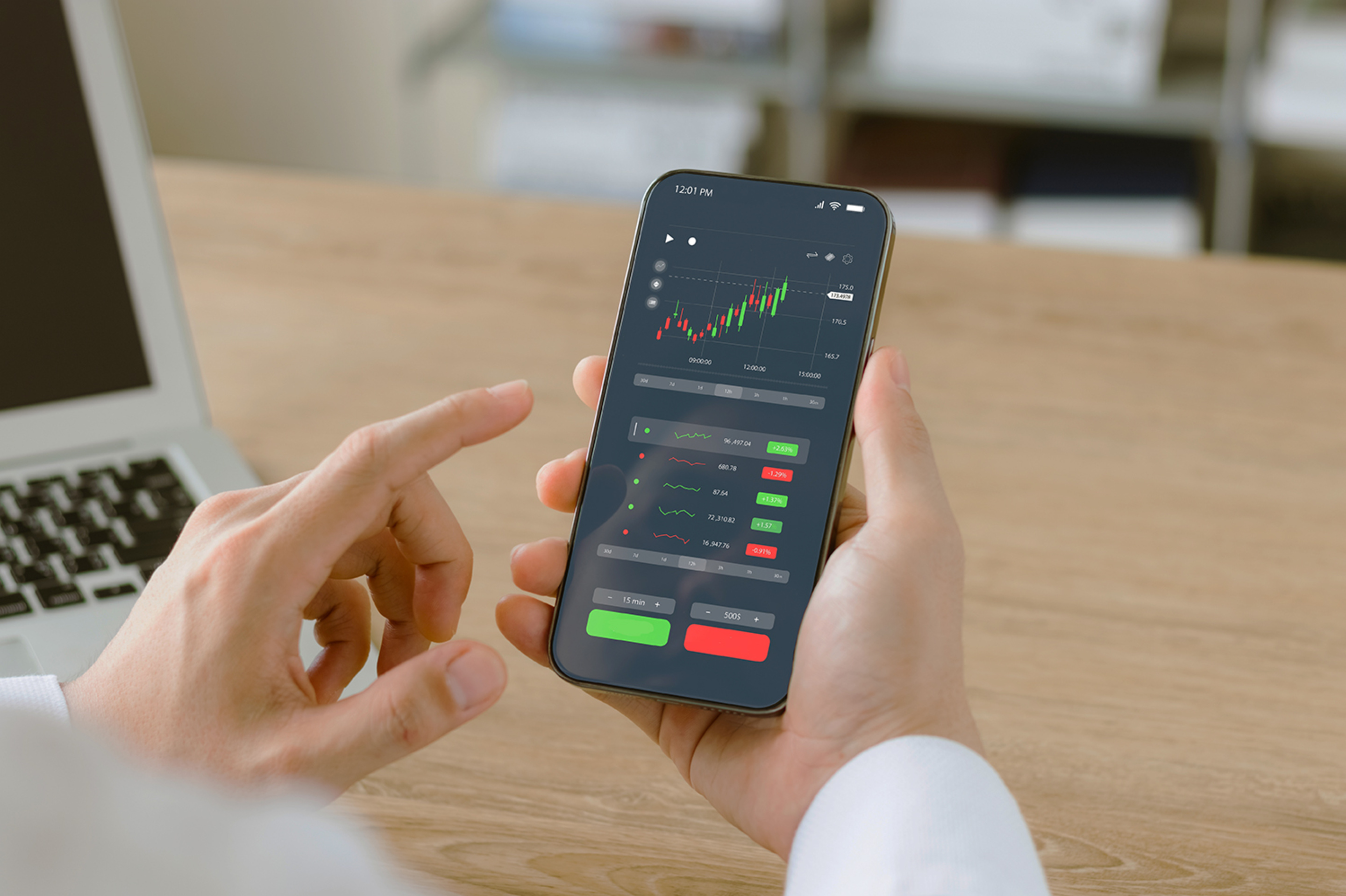 Businessmen work with stock market investments using smartphones to analyze trading data. smartphone with stock exchange graph on screen. Financial stock market